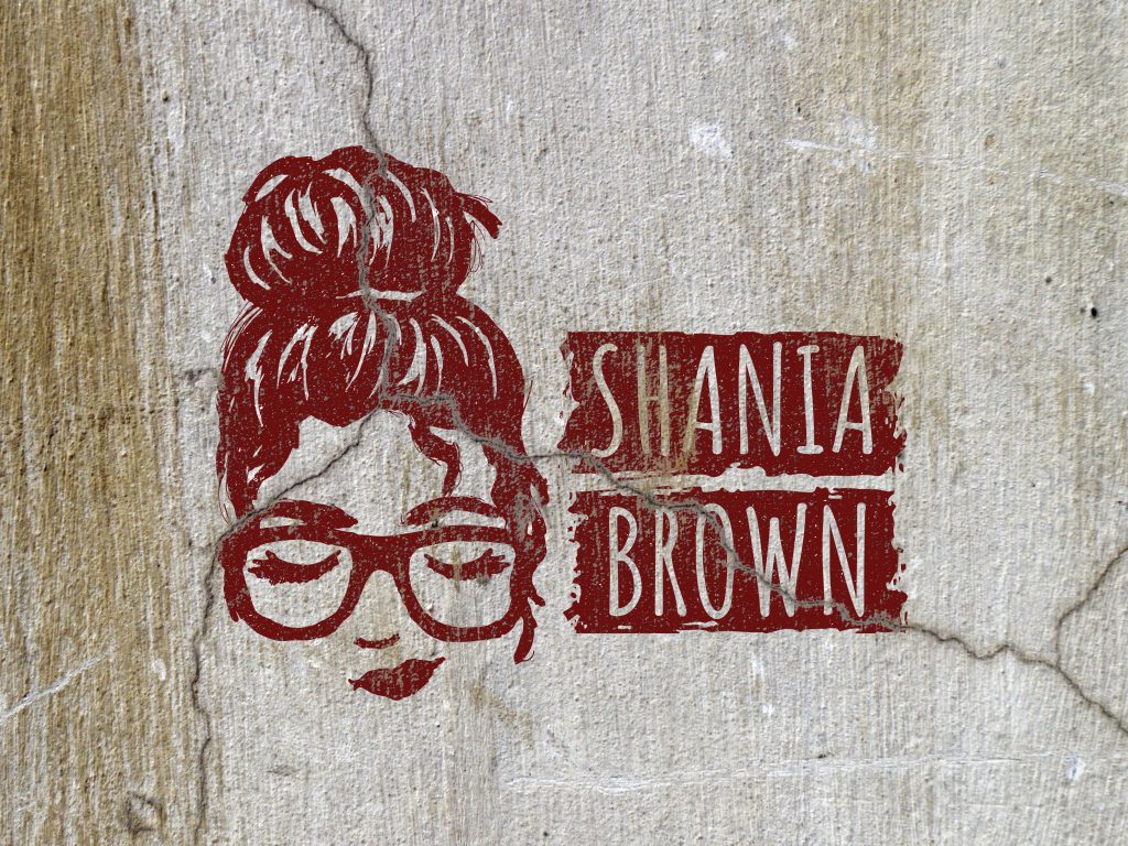 Shania Brown logo painted on cracked wall